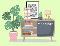 a living room with books, a plant and a planter